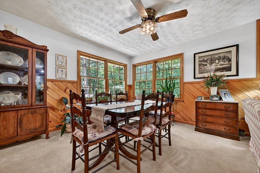 Charming cottage home nestled on nearly 7 private wooded acres - photo 8