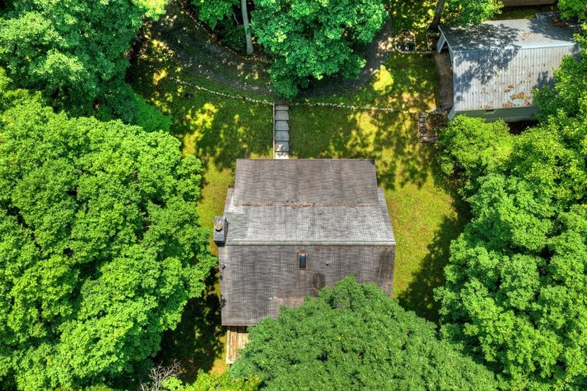 Charming cottage home nestled on nearly 7 private wooded acres - photo 10
