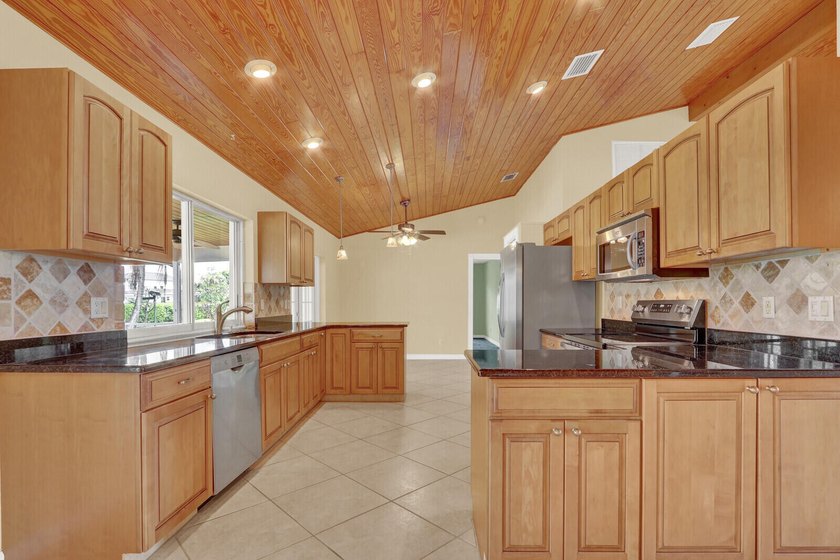 Welcome to Tequesta Country Club, where golf course living meets - photo 14