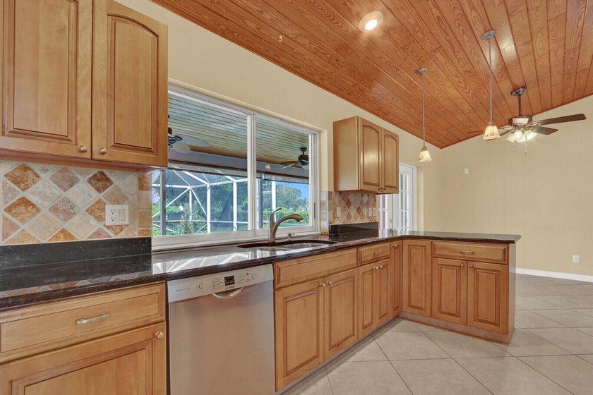 Welcome to Tequesta Country Club, where golf course living meets - photo 16
