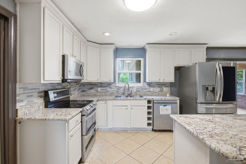 Don't miss this spacious 4 bedroom, 2 bathroom home conveniently - photo 11