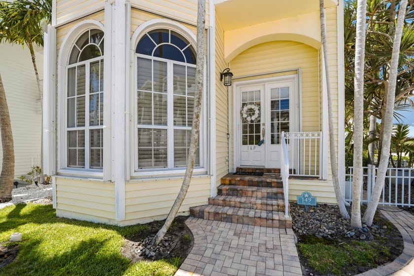 Located in the gated Jupiter Key community just steps from the - photo 3