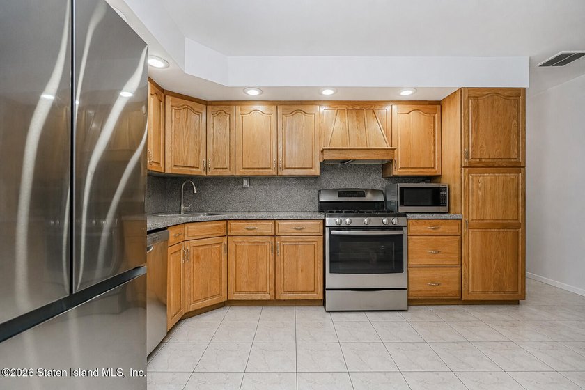 Welcome to 323 Main Street, a brick ranch set in the heart of - photo 12
