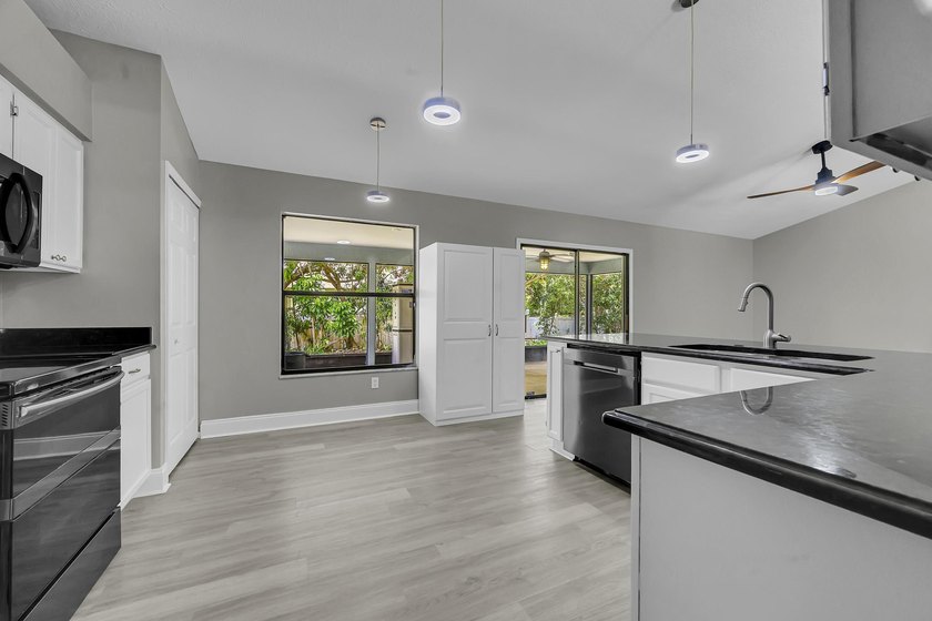 Welcome to this charming 3/2/2 home located on an oversized - photo 13