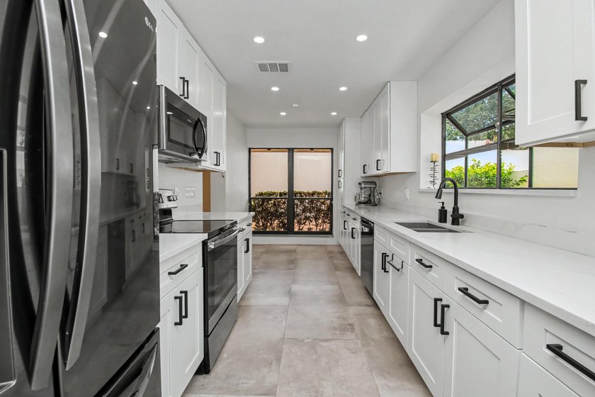 This beautifully updated 3-bedroom, 2-bathroom residence offers - photo 15