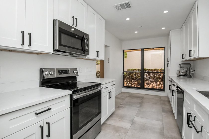 This beautifully updated 3-bedroom, 2-bathroom residence offers - photo 17