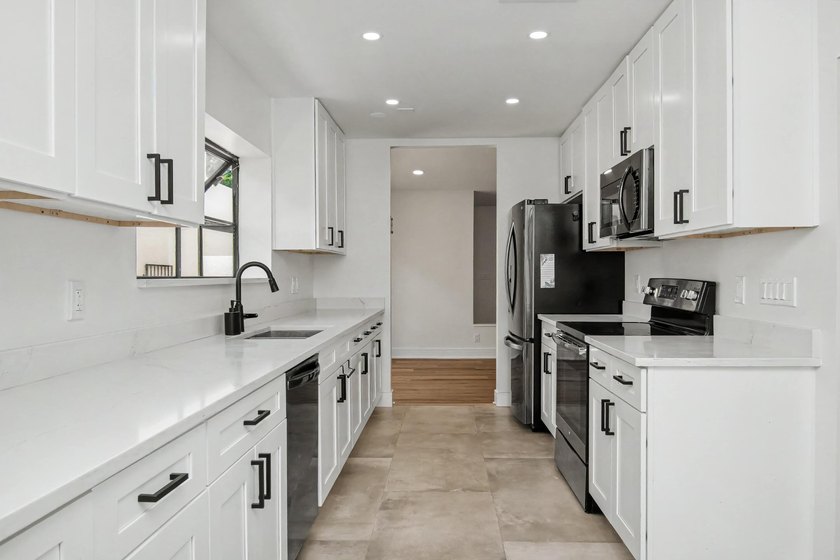This beautifully updated 3-bedroom, 2-bathroom residence offers - photo 19