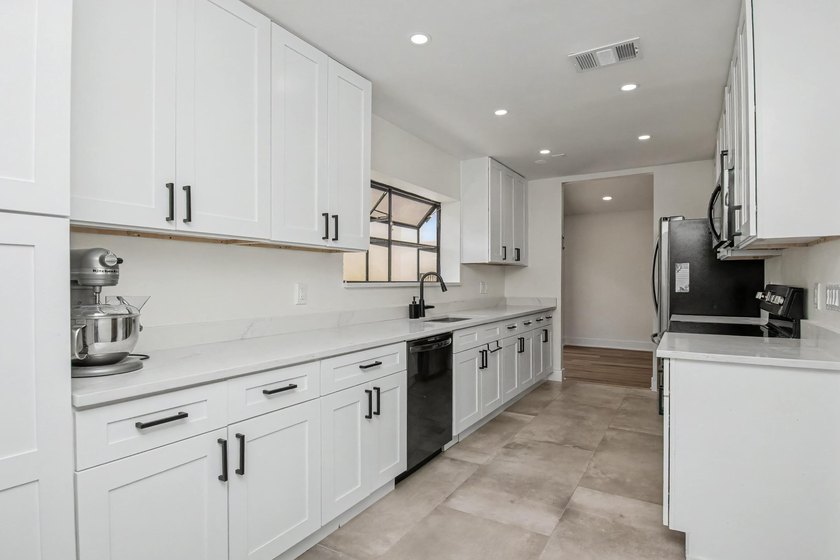 This beautifully updated 3-bedroom, 2-bathroom residence offers - photo 20