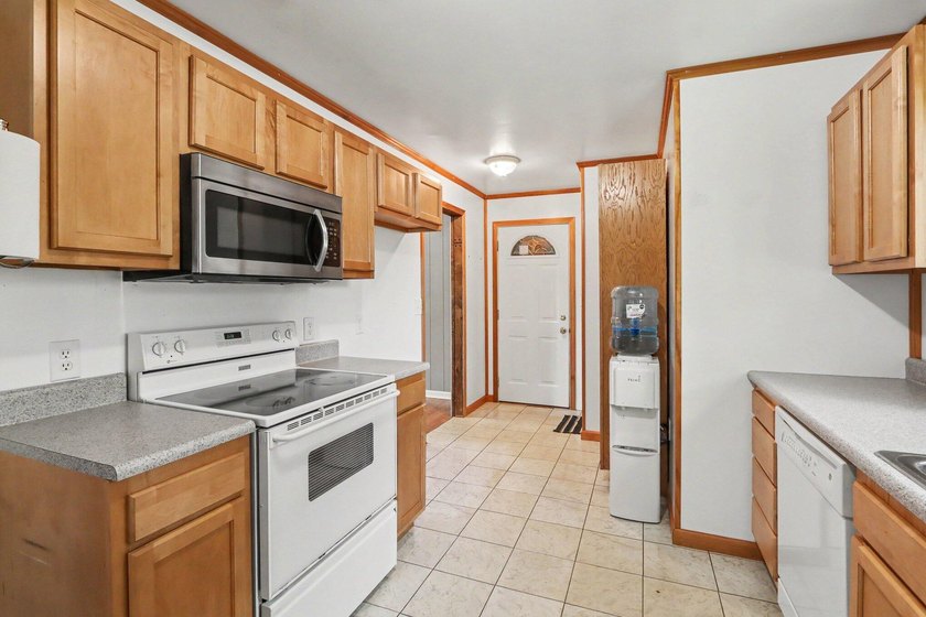 Welcome to this spacious 4-bedroom home, perfectly situated on a - photo 6