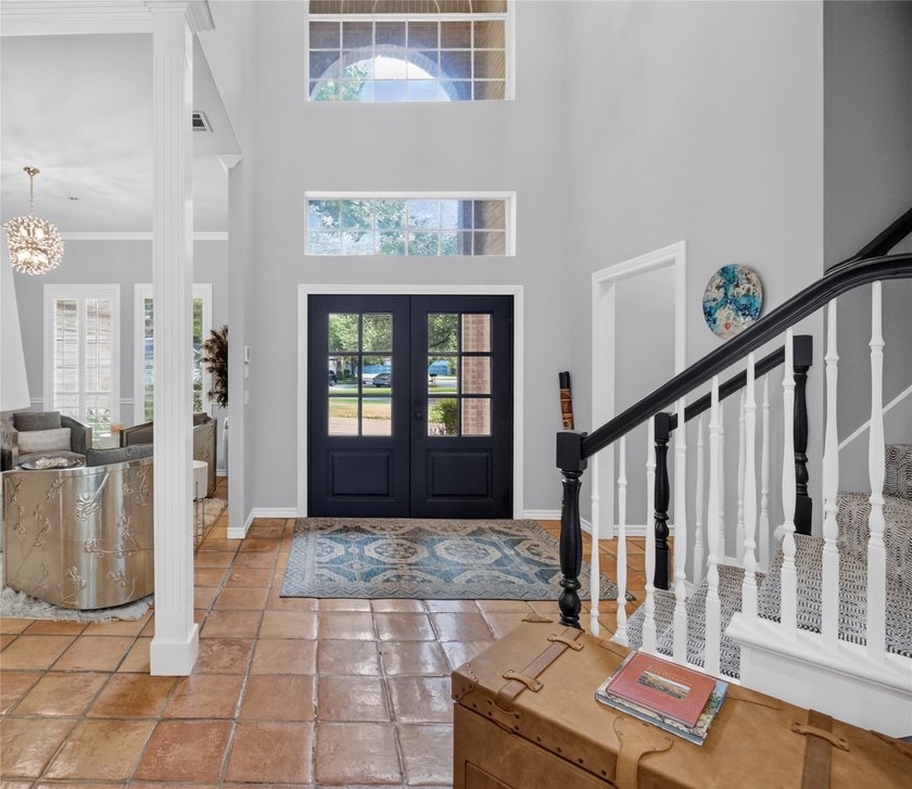Nestled beneath mature shade trees in the prestigious gated - photo 4