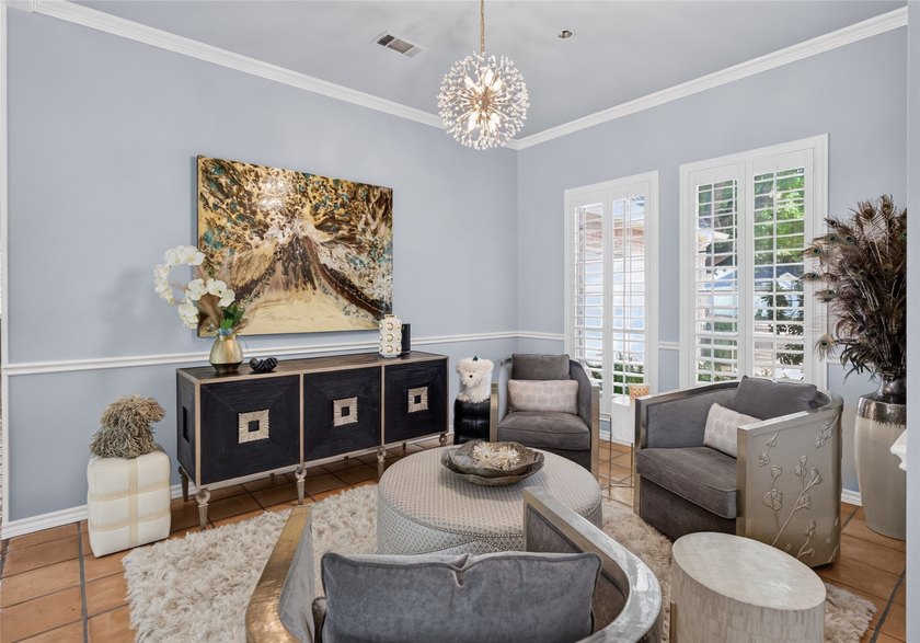 Nestled beneath mature shade trees in the prestigious gated - photo 7
