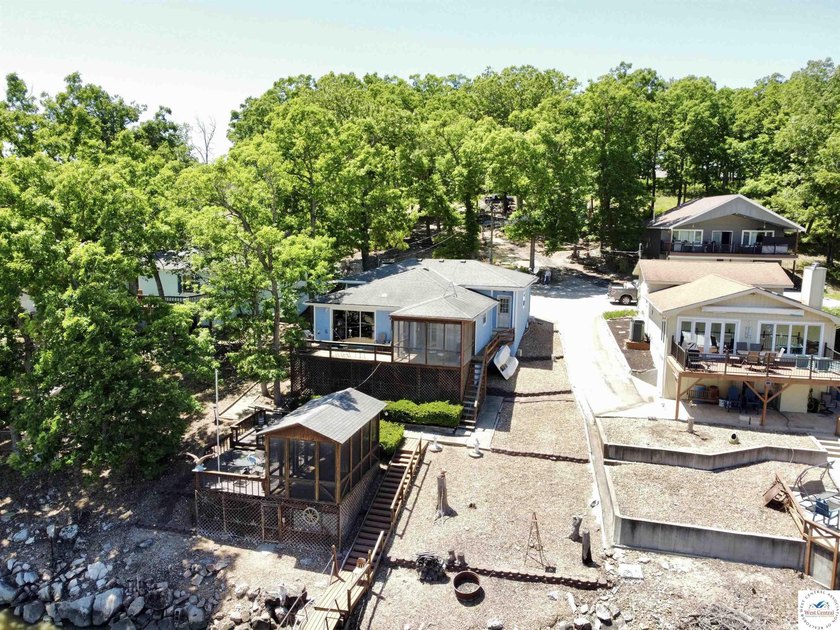 Located on a quiet cove on the Lake of the Ozarks in a very - photo 11