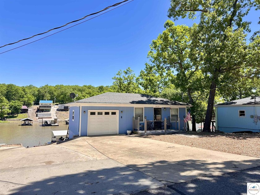 Located on a quiet cove on the Lake of the Ozarks in a very - photo 30