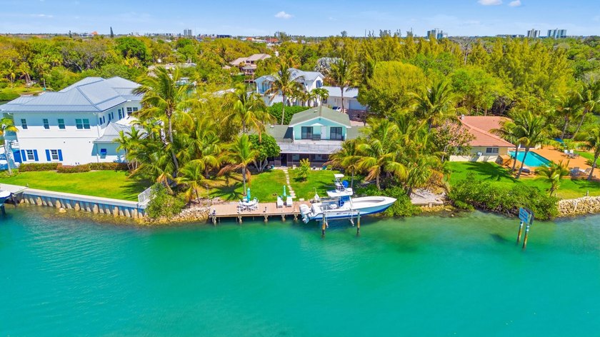 Discover Your Hidden Paradise! This charming riverfront property - photo 19