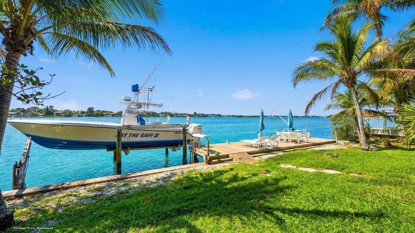 Discover Your Hidden Paradise! This charming riverfront property - photo 24