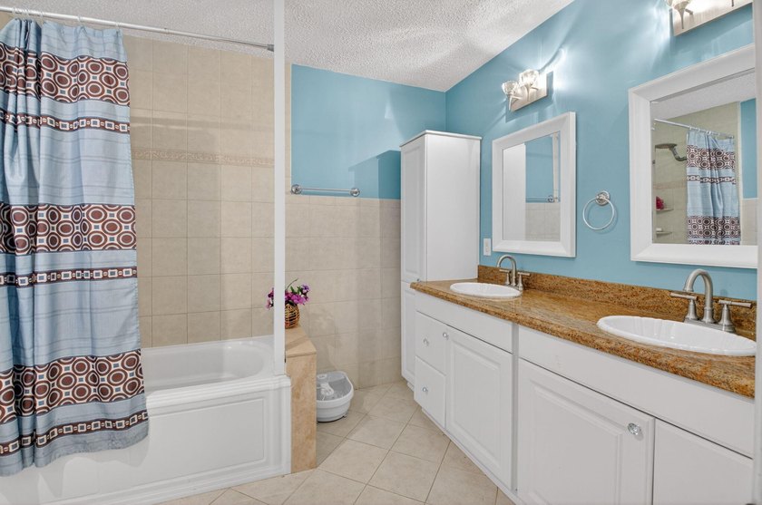 This beautifully renovated 3-bedroom, 2-bath home is tucked away - photo 24