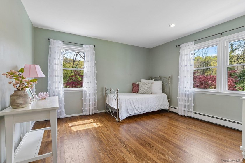 Set on a full acre and surrounded by mature trees and lush - photo 18