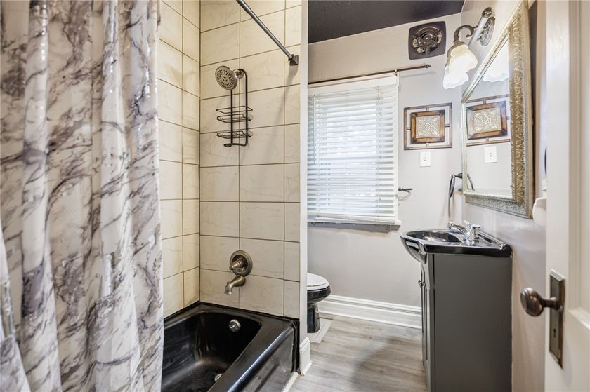 This charming home is nestled in Rochester's beloved Charlotte - photo 13