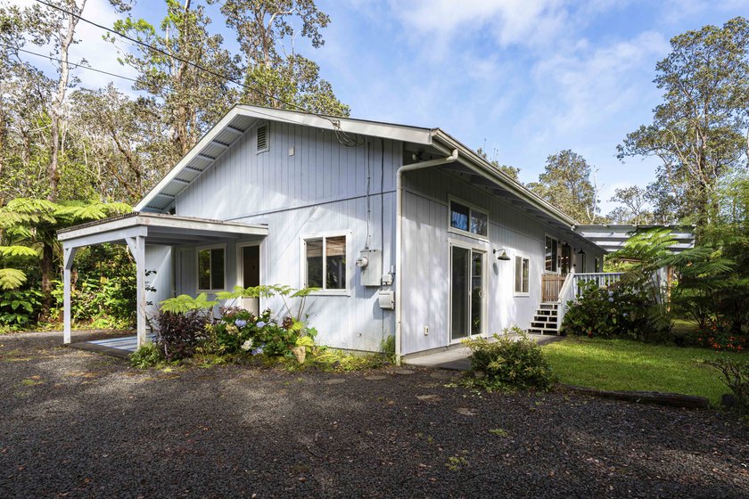 Nestled among lush hapuu ferns, majestic Ohia Lehua trees, and - photo 3