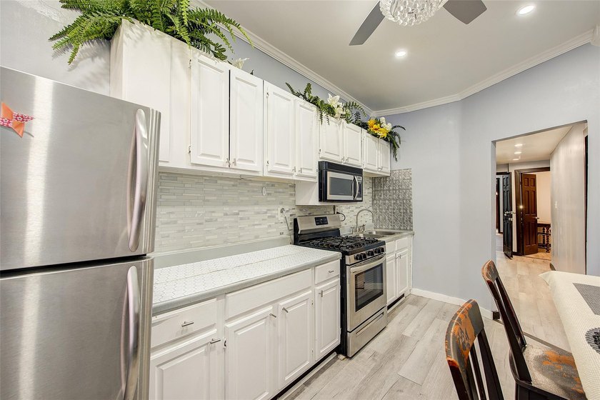 This stunning and meticulously maintained all-brick two-family - photo 32