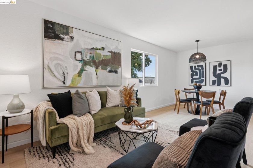 Top floor sun-splashed 2 Bedroom and 1 bath updated condo is - photo 2