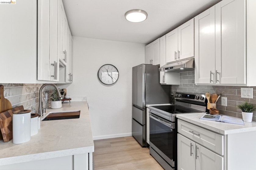 Top floor sun-splashed 2 Bedroom and 1 bath updated condo is - photo 6
