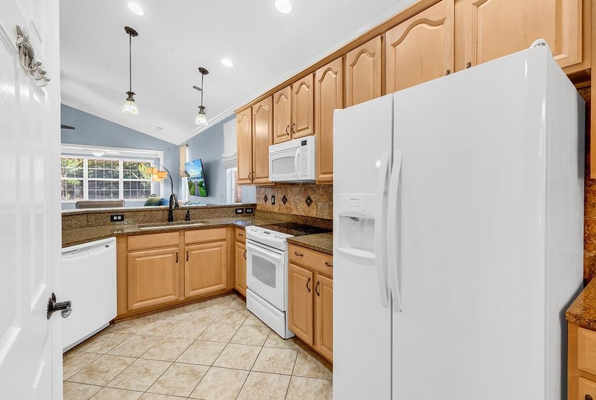 Located on a quiet side street within the highly sought-after - photo 11
