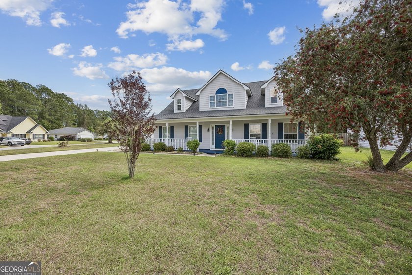 As you arrive at this Baytown-style home, you're welcomed by a - photo 2