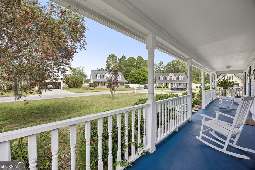 As you arrive at this Baytown-style home, you're welcomed by a - photo 5