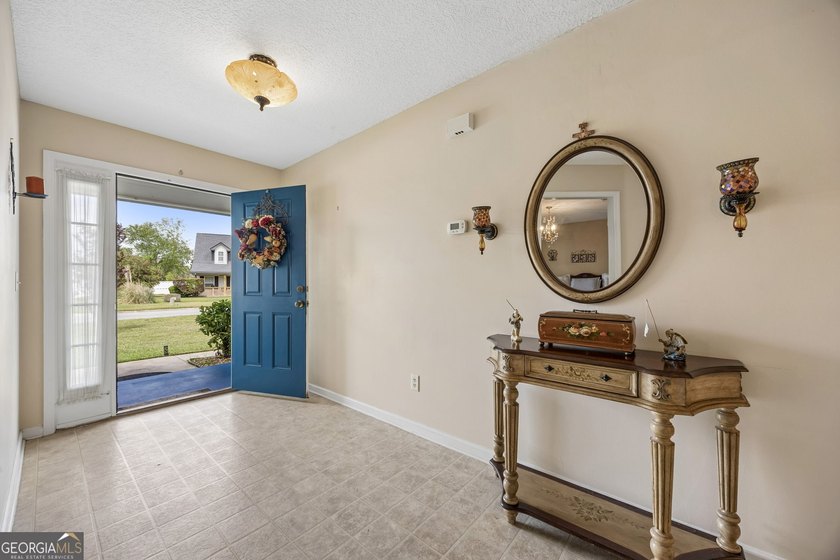 As you arrive at this Baytown-style home, you're welcomed by a - photo 6
