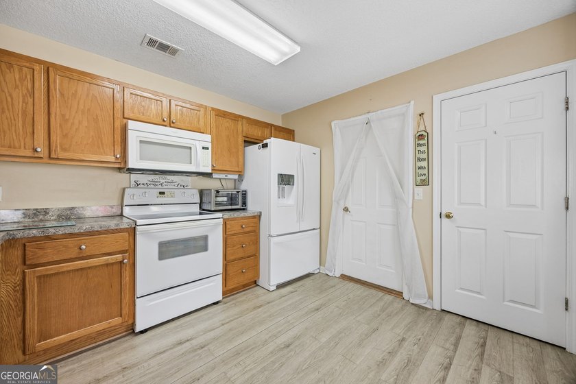 As you arrive at this Baytown-style home, you're welcomed by a - photo 10
