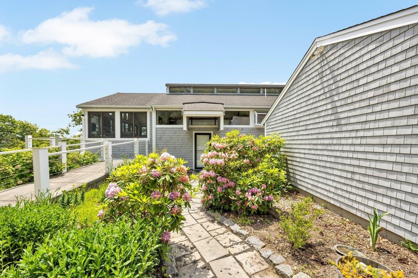 Set on over 3 private acres along the protected shores of - photo 12
