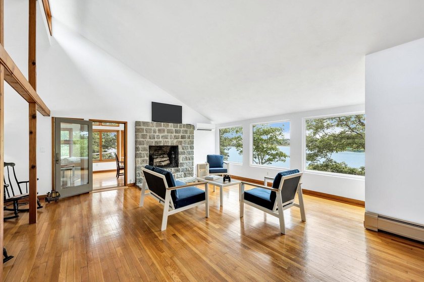 Set on over 3 private acres along the protected shores of - photo 15