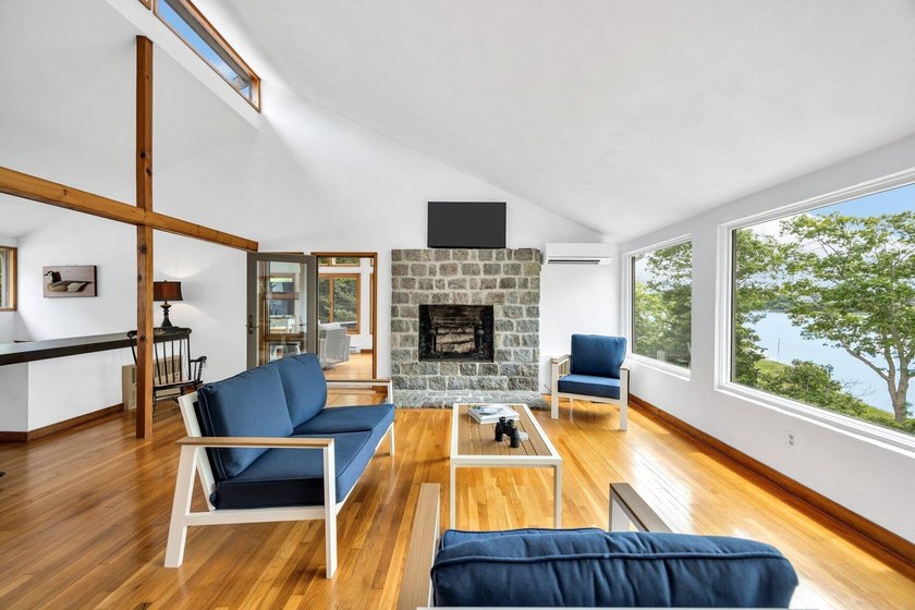 Set on over 3 private acres along the protected shores of - photo 16