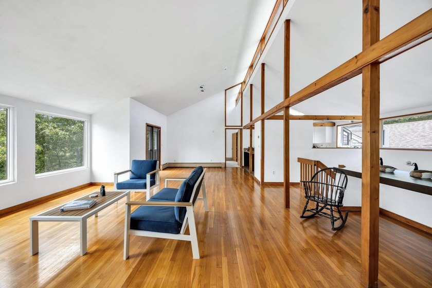 Set on over 3 private acres along the protected shores of - photo 17