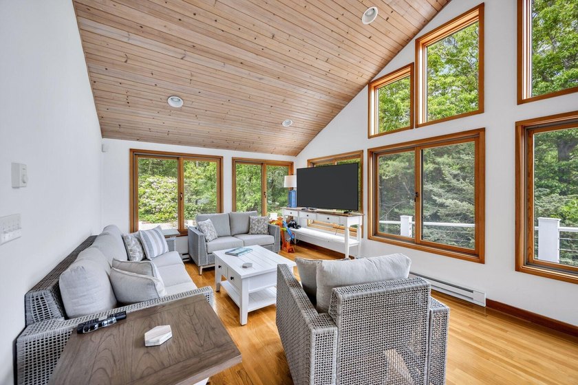 Set on over 3 private acres along the protected shores of - photo 23