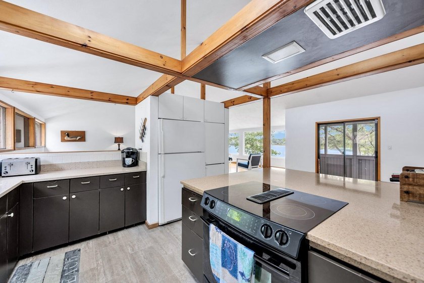 Set on over 3 private acres along the protected shores of - photo 26
