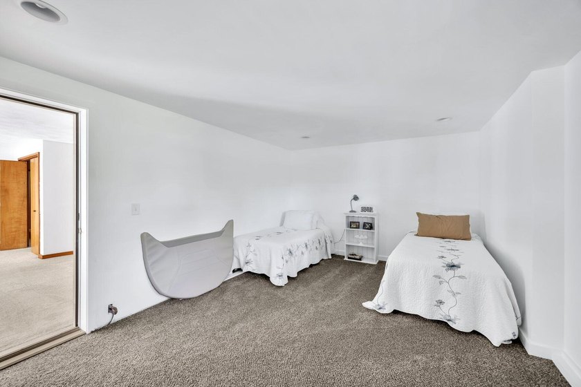 Set on over 3 private acres along the protected shores of - photo 34