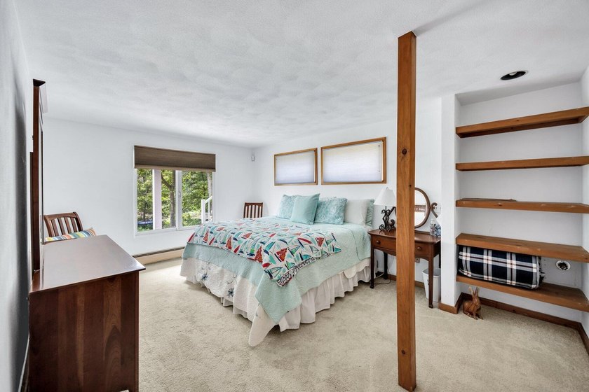 Set on over 3 private acres along the protected shores of - photo 39