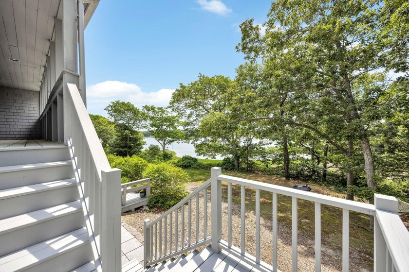 Set on over 3 private acres along the protected shores of - photo 41