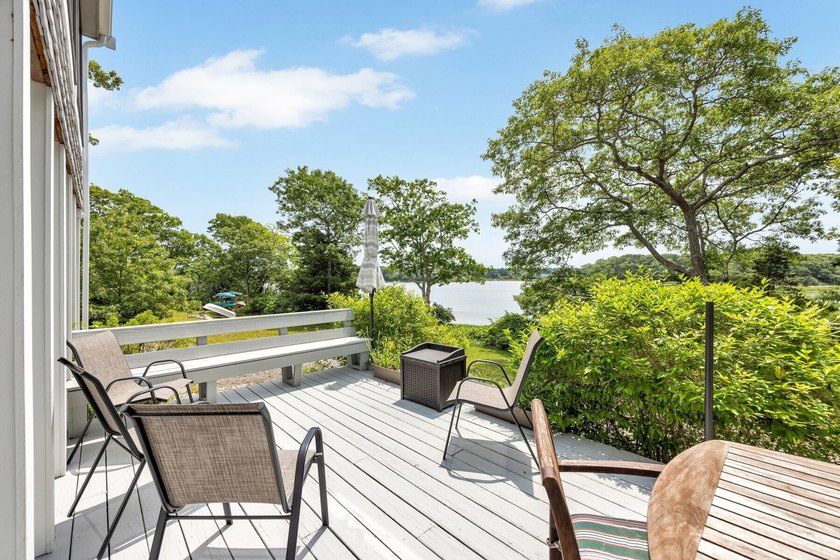 Set on over 3 private acres along the protected shores of - photo 42