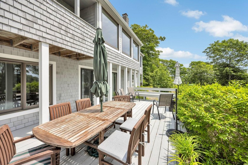 Set on over 3 private acres along the protected shores of - photo 44