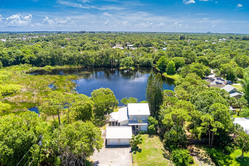 Rare lakefront sanctuary with endless possibilities! Own this - photo 2
