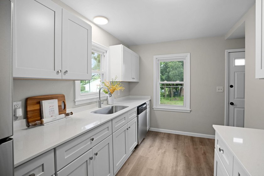 Fresh renovations and a thoughtful layout make this 3-bedroom - photo 15
