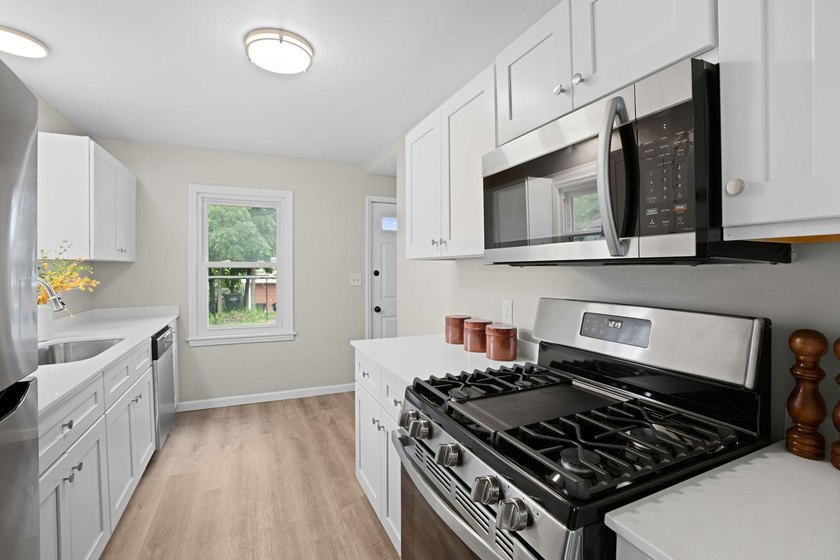 Fresh renovations and a thoughtful layout make this 3-bedroom - photo 16