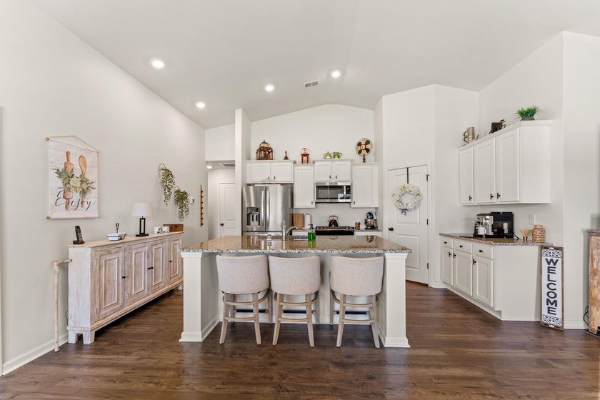 Situated in the Towns at Heather Glen community, this light and - photo 12