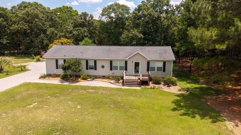 Enjoy country living on this 10-acre property with two homes - photo 15