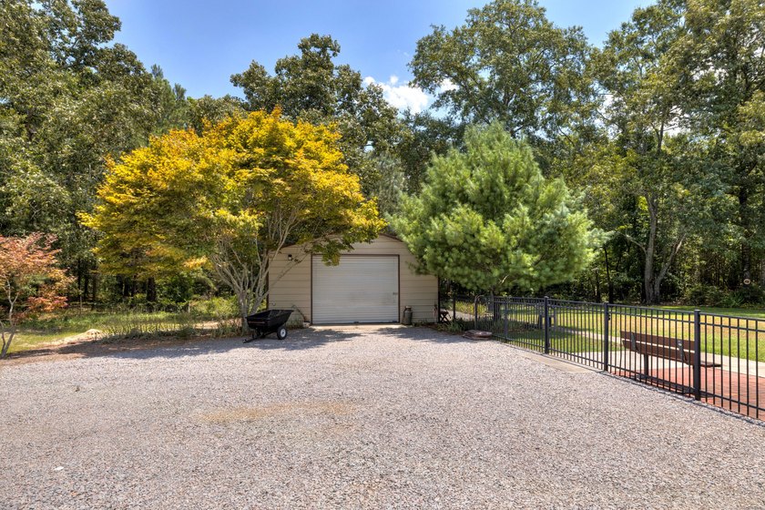 Enjoy country living on this 10-acre property with two homes - photo 16