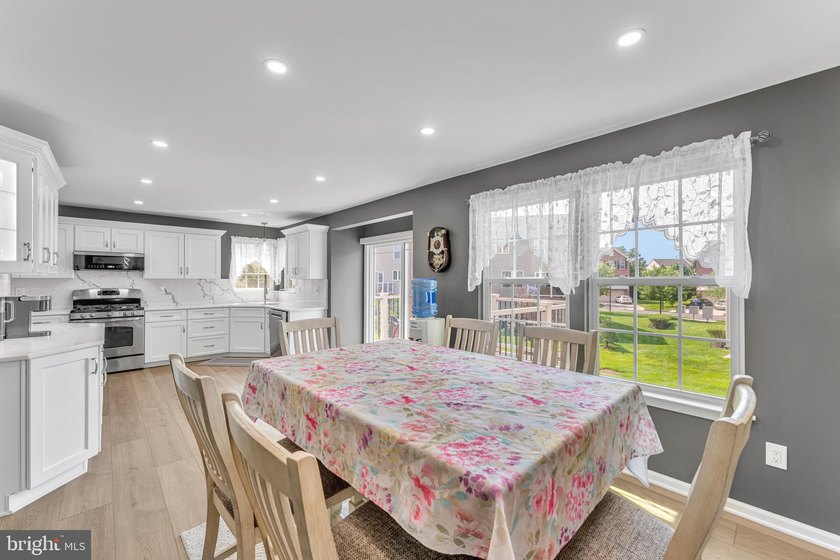 Welcome to this beautifully maintained end-unit townhome in the - photo 12