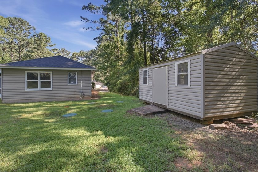 Quaint country living with this remodeled 4BR 2BA home sitting - photo 3